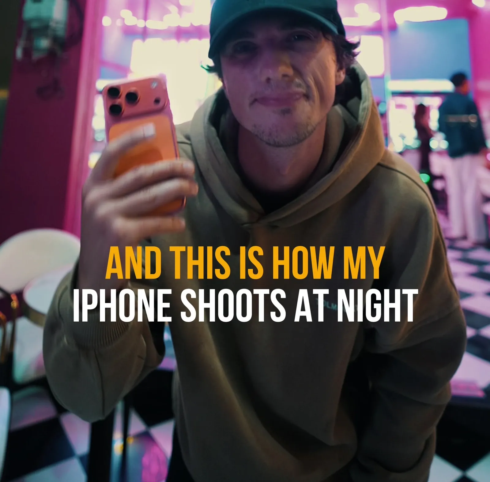 Creator holding iPhone in Freewell Filmmaker Case for night filmmaking tutorial