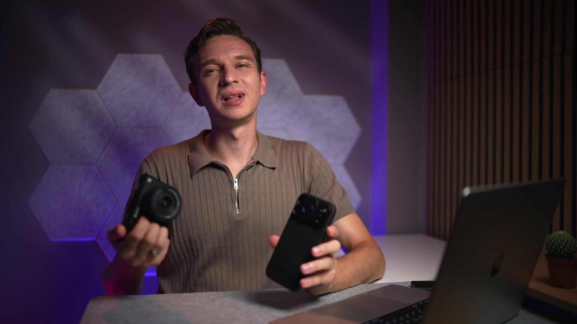 Freewell presenter holding the Sony ZV-E10 II and the iPhone 18 Pro Max side by side