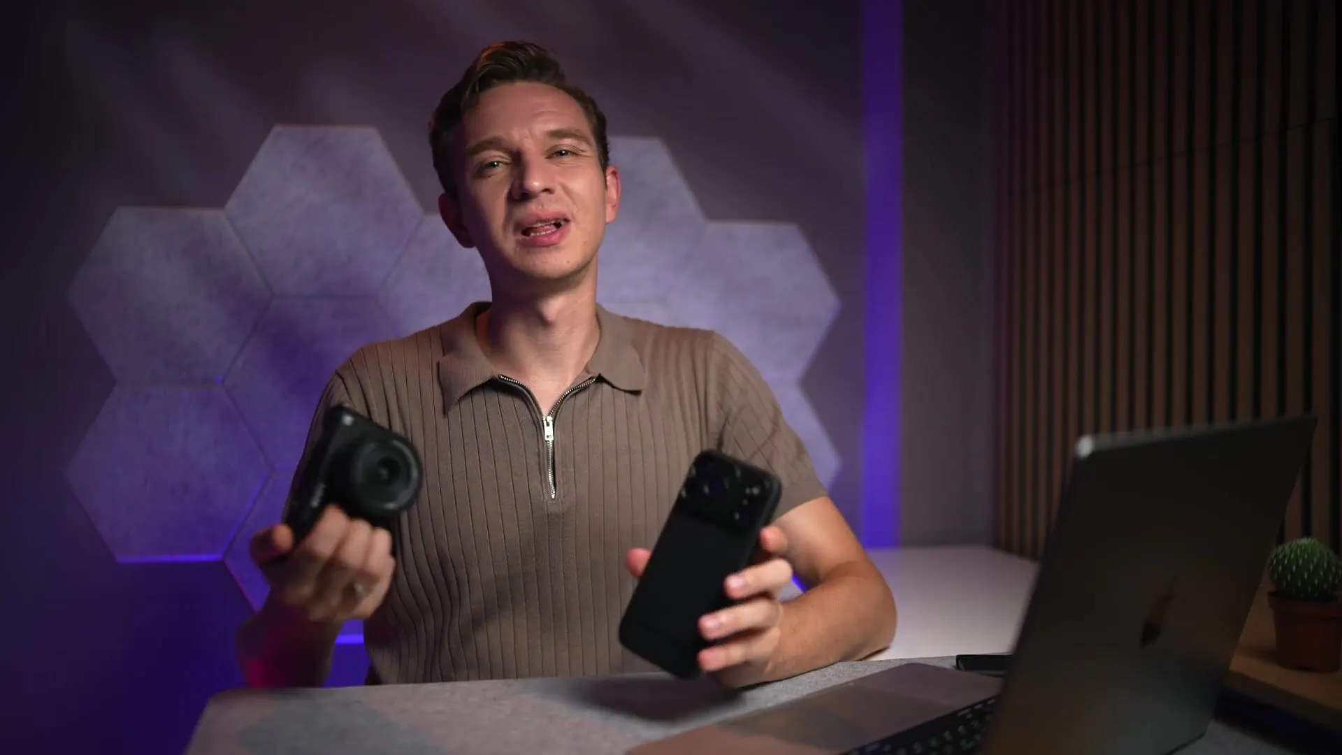 Freewell presenter holding the Sony ZV-E10 II and the iPhone 18 Pro Max side by side